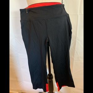 Forever 21 Capri leggings. size M. Black and orange